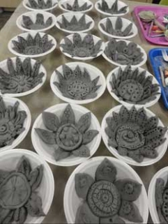 Clay art in individual bowls.