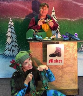 Actors dressed as an elf and a shoemaker.